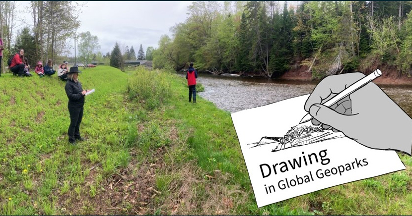 Drawing in Geoparks logo - an illustration of a hand holding a pencil and drawing a landscape with the background of a river and people drawing.